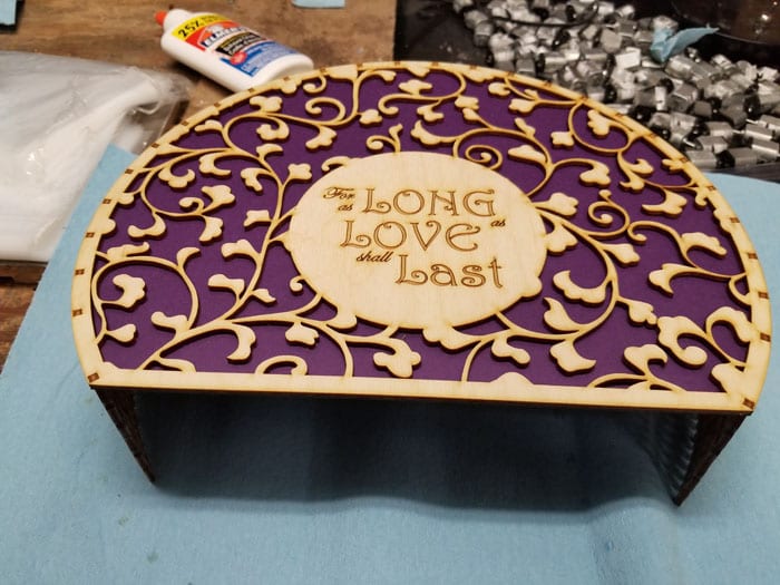 Exterior of the Ocarina Box with the lattice design and the'For as Long as Love Shall Last,' inscription