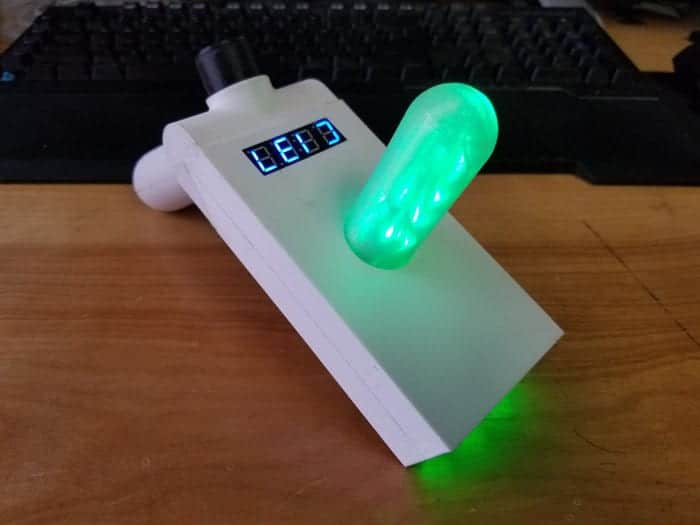 Completed Rock and Morty Portal gun sitting on a wooden surface