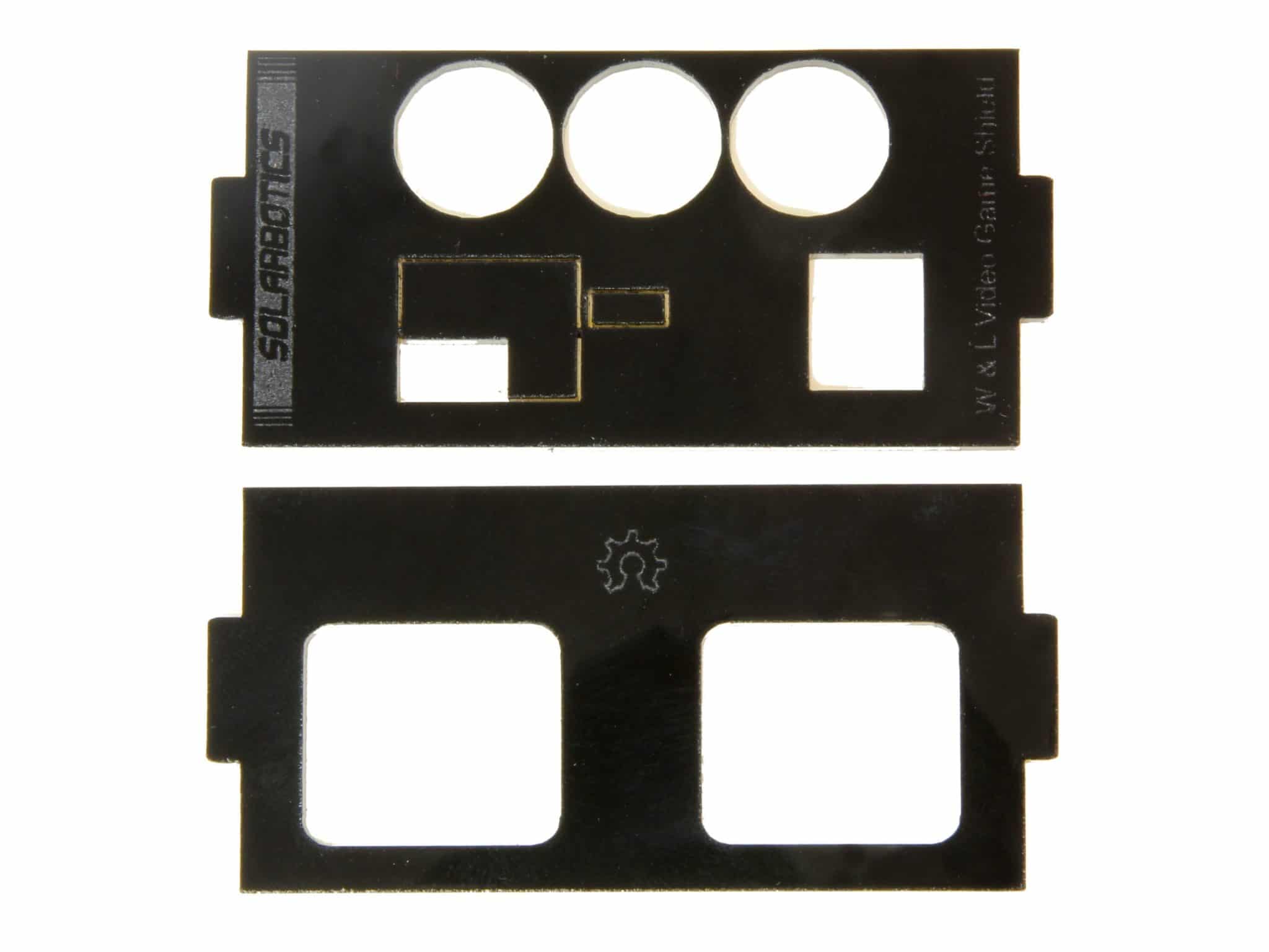Two piece of black acrylic plastic sheet that has been laser-cut with holes to accommodate connectors.